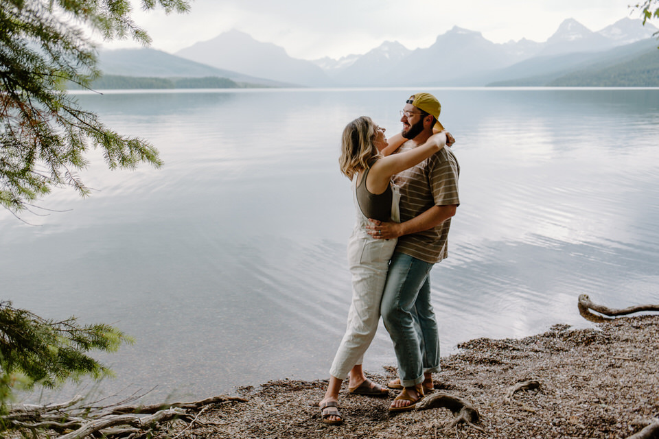 couple hugs during their glacier park engagement session