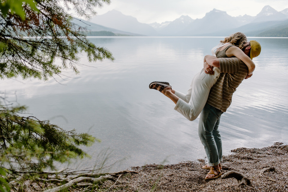 couple hugs during their glacier park engagement photo