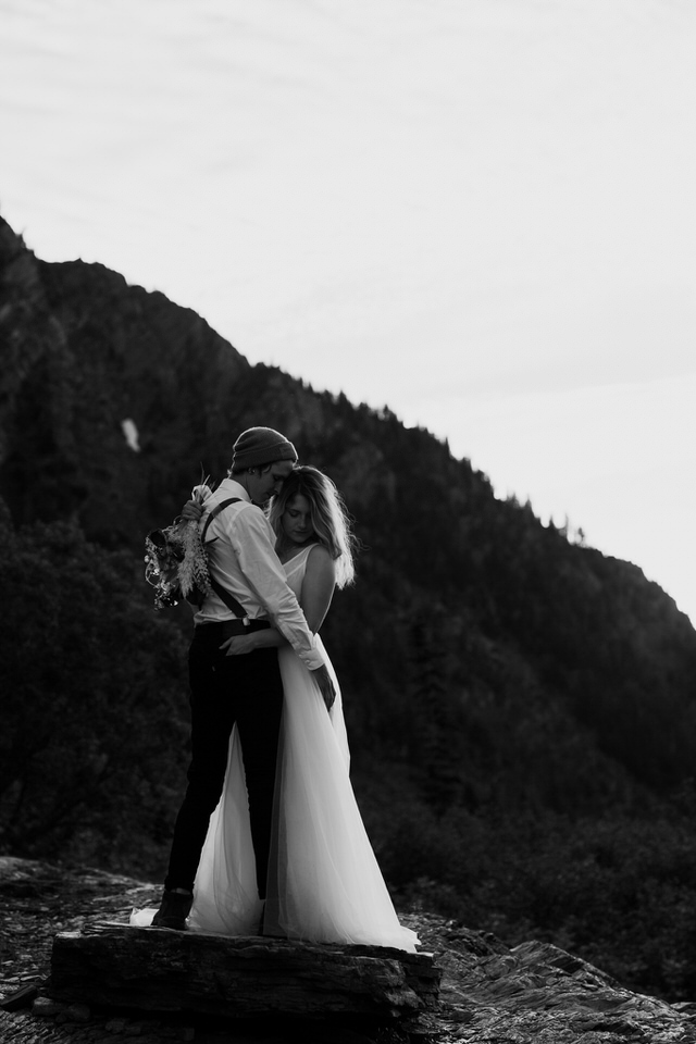 bridal couple holds each other close in libby montana