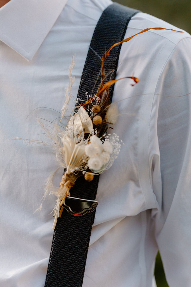 alternative boutonnieree attached to suspenders