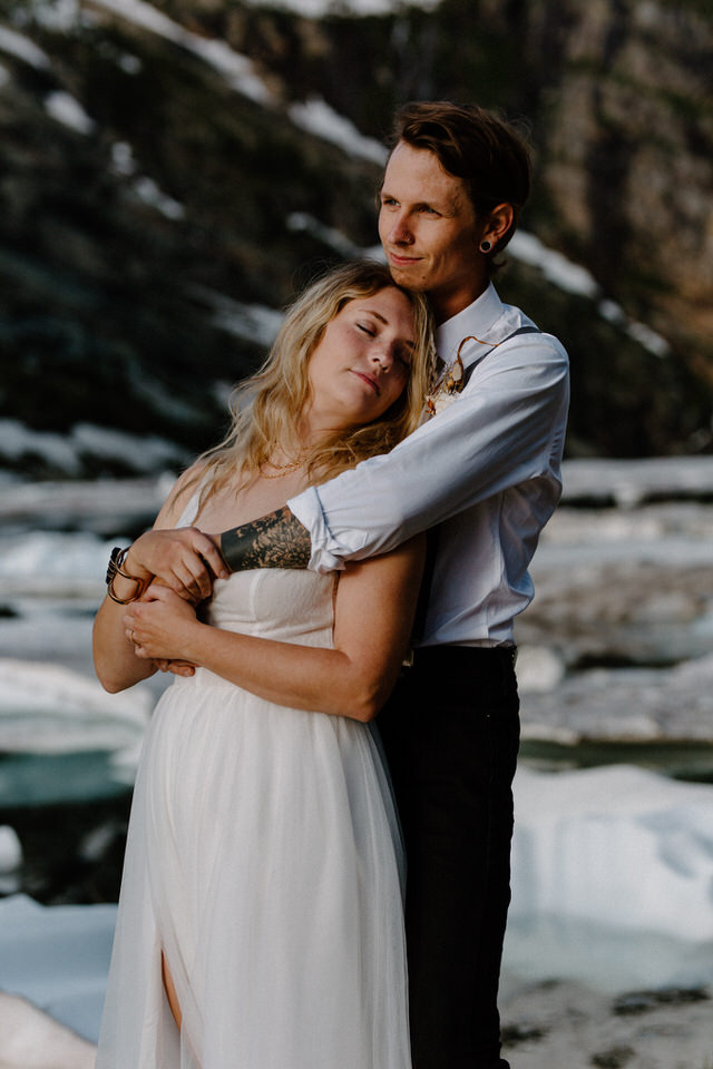 alternative couple in front of iceberg elopement