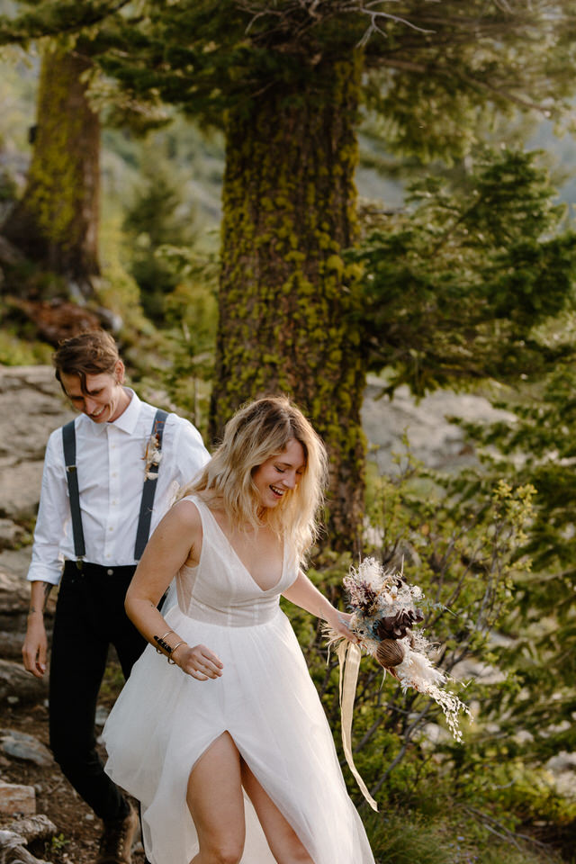 bride and groom hike during montana elopement