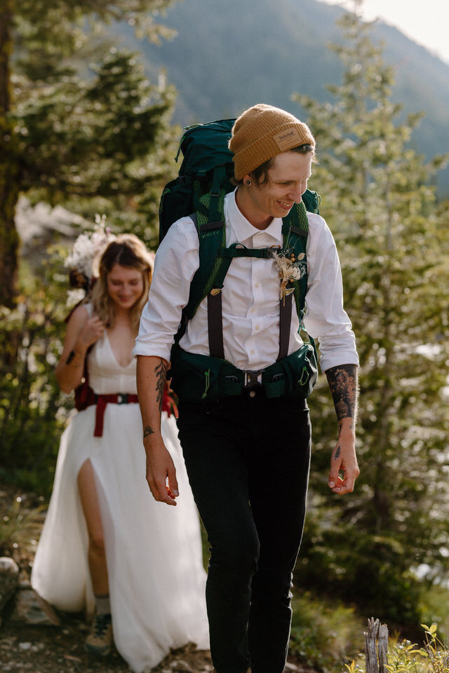 Couple backpacks during elopement