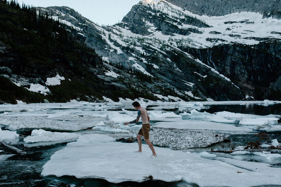 groom walks across icebergs in leigh lake montana