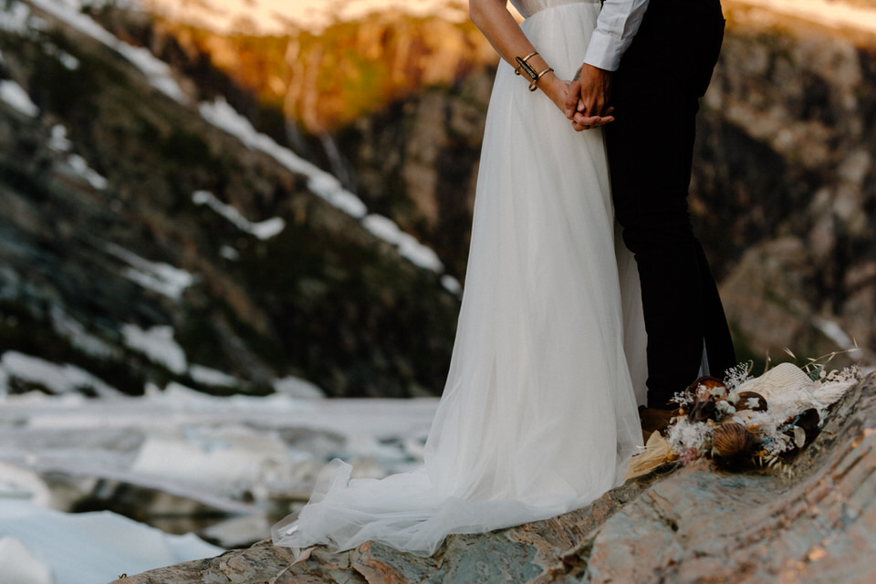 wedding dress on boulder at leigh lake montana