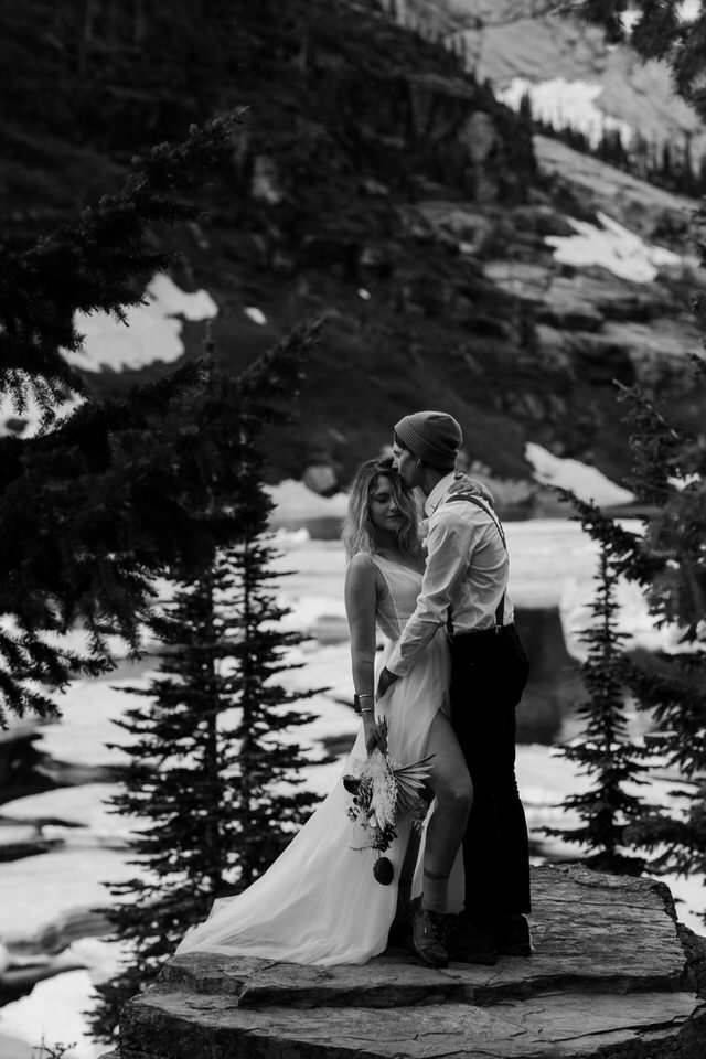 couple kisses during leigh lake wedding