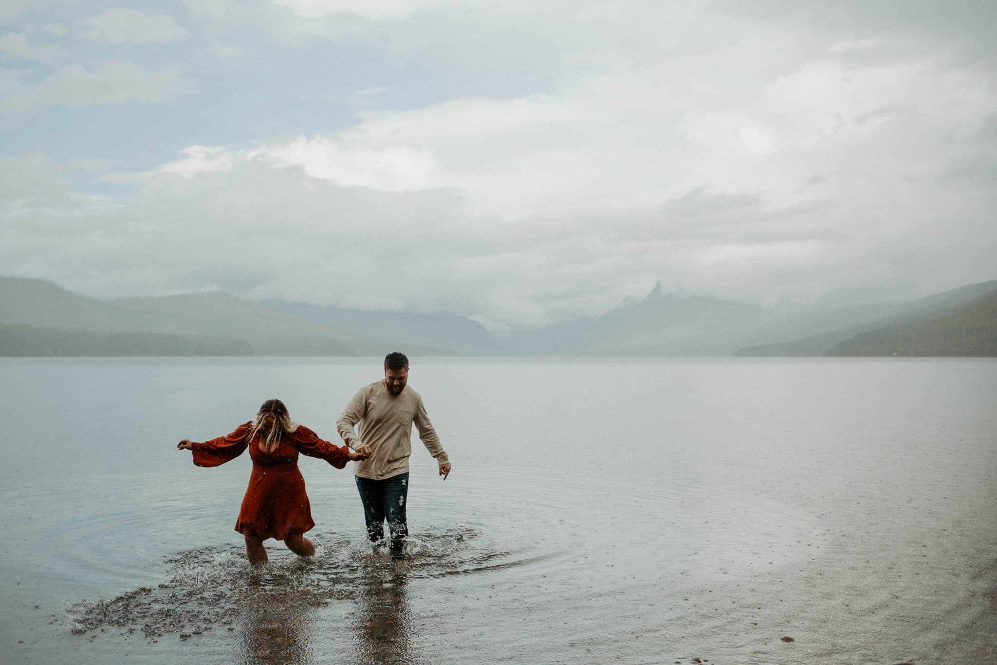 engaged couple in lake mcdonald